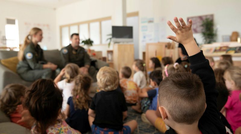 A McGraths Hill Learning Centre student raises his hand to ask questions during a visit from No 37 Squadron members, Flight Lieutenant Brendan Smith and Corporal Natashia Jorgensen. Story by Tastri Murdoch. Photo by Leading Aircraftwoman Maddison Scott.
