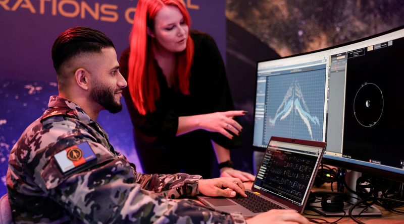 Able Seaman Qambar Said with US Space Force personnel working at the Commercial Operations cell, Adelaide. Photos by Tim Standing.