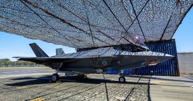 An F-35A Lightning II aircraft under a temporary aircraft revetment, which is being trialled at RAAF Base Williamtown, NSW. Story by Flight Lieutenant Rob Hodgson. Photos by Sergeant Craig Barrett.