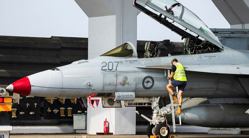 A RAAF aviator finalises a systems check of an F/A-18F Super Hornet at Royal Malaysian Air Force Base Butterworth during Exercise Bersama Lima, Malaysia. Story by Flying Officer Connor Bellhouse. Photos by Corporal Sam Price.