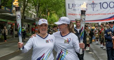 Legacy torchbearers Emily Lahay and Commander 4th Brigade, Brigadier Michelle Campbell during the last leg of the Legacy Centenary Torch Relay in Melbourne. Story by Captain Mark Blackman and Captain Kristen Daisy Cleland. Photo by Corporal Michael Currie.