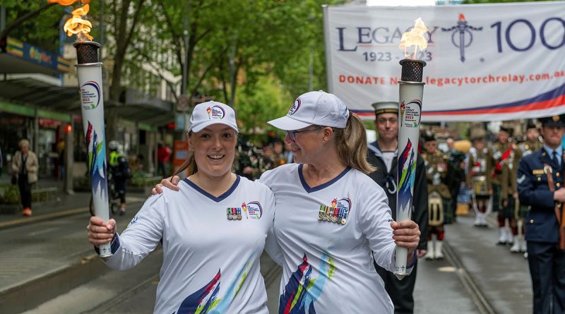 Legacy torchbearers Emily Lahay and Commander 4th Brigade, Brigadier Michelle Campbell during the last leg of the Legacy Centenary Torch Relay in Melbourne. Story by Captain Mark Blackman and Captain Kristen Daisy Cleland. Photo by Corporal Michael Currie.