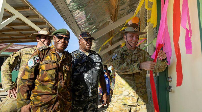 Brigadier David McCammon, right, officially opens renovated classrooms with Papua New Guinea Defence Force (PNGDF) representatives during Exercise Puk Puk, Manus Island, PNG. Story by Major Taylor Lynch. Photos by Lance Corporal Riley Blennerhassett.