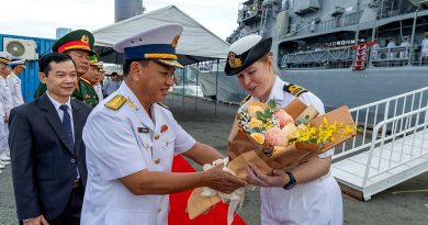 Lieutenant Commander Emily Ross accepts flowers from Vietnam People's Navy Captain Ngyuen Viet Ahn during HMAS Toowoomba's departure ceremony at Ho Chi Minh City, Vietnam, as part of Indo-Pacific Endeavour. Story by Sub-Lieutenant Tahlia Merigan. Photos by Leading Seaman Ernesto Sanchez.