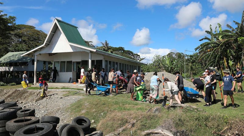 Members of the Solomons International Assistance Force work with the Alligator Creek community to repair coastal erosion at the Seventh Day Adventist Church, Alligator Creek, Solomon Islands.