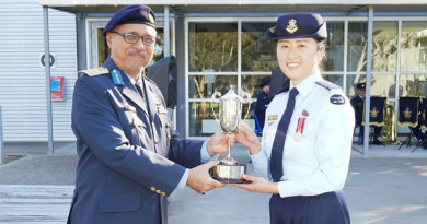 RMAF Brigadier Ben Khedda presents the Gary Haynes trophy to Pilot Officer Pearl Jeong, at RAAF Base East Sale. Story by Flying Officer Rowan Crinall. Photo by Flight Lieutenant Daina Sawade.