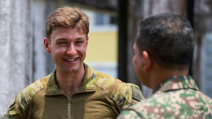 Australian Army Platoon Commander Lieutenant John Haycroft converses with Malaysian Armed Forces Major Hazwan through their shared second language, Indonesian, during Exercise Bersama Lima, Kuantan, Malaysia. Story by Flying Officer Connor Bellhouse. Photo by Corporal Sam Price.