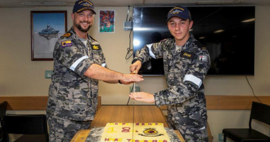 Commanding Officer HMAS Toowoomba Commander Darin MacDonald, left, and youngest crewmember, Seaman Jack Lefevre, cut Toowoomba’s 18th birthday cake during a regional presence deployment. Story by Story by Lieutenant Commander Andrew Herring. Photo by Leading Seaman Ernesto Sanchez.