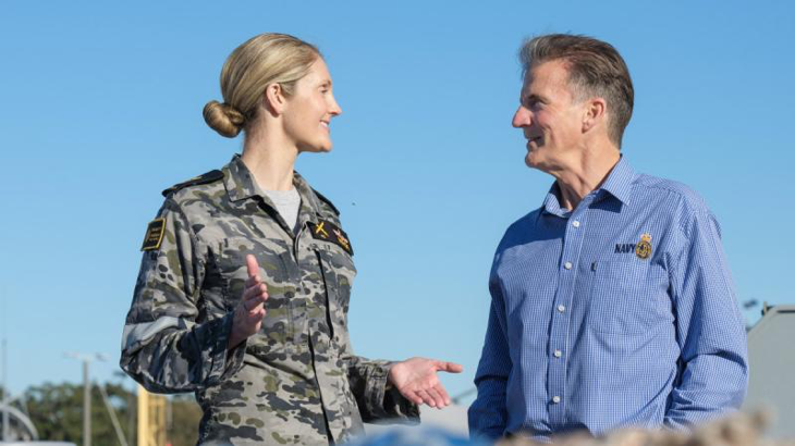 Commander Andrew Mierisch, right, with Chief Petty Officer Zoe Mack on board HMAS Supply alongside Fleet Base East, Sydney. Story by Lieutenant Commander Nicholas Robinson. Photo by Leading Seaman Jarryd Capper.