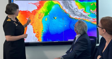 Hydrographer of Australia Commodore Robyn Phillips, Australian Hydrographic Office (AHO) Director Maritime Data Management Doug White and AHO Director Maritime Relationships and Governance Nat McLean use the Australian Bathymetric and Topography Grid. Story by Elizabeth de Bol.