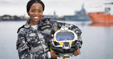 Gap Year Seaman Vimbayi Hakutangwi with a dive helmet at HMAS Stirling, Western Australia. Story by Richard Wilkins. Photo by Able Seaman Rikki-Lea Phillips.
