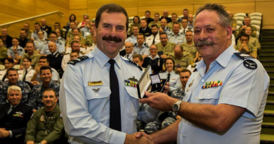 Then Chief of Air Force Air Marshal Leo Davies, left, presents Warrant Officer Wayne Newman with his second clasp to the Federation Star for 45 years’ service in the RAAF in 2016. Story by Corporal Madhur Chitnis. Photo by Corporal David Cotton.