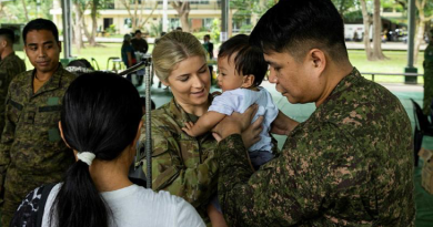Australian Army nurse Lieutenant Chloe Apps and Philippines military nurse Second Lieutenant Ian B De La Cruiz conduct physical examinations for local children at Fort Magsaysay, Philippines. Story by Lieutenant Geoff Long. Photo by Leading Aircraftwoman Emma Schwenke.