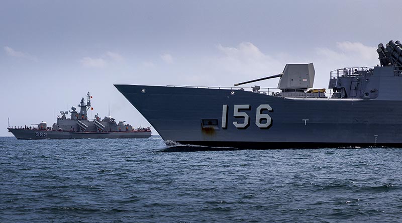 HQ-382 Tarantal-V-class ship from the Vietnam People's Navy and Royal Australian Navy's HMAS Toowoomba conduct officer-of-the-watch manoeuvres during regional presence deployment 2023 off the coast of Ho Chi Minh City. Photo by Leading Seaman Ernesto Sanchez.