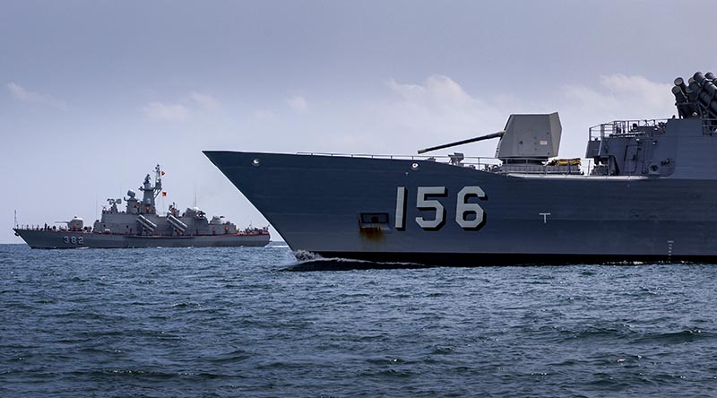 HQ-382 Tarantal-V-class ship from the Vietnam People's Navy and Royal Australian Navy's HMAS Toowoomba conduct officer-of-the-watch manoeuvres during regional presence deployment 2023 off the coast of Ho Chi Minh City. Photo by Leading Seaman Ernesto Sanchez.