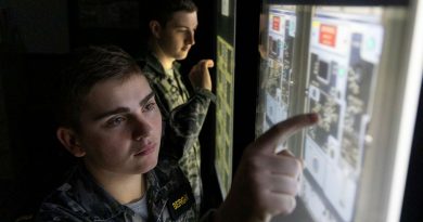 Information systems specialist Seaman Kyle Bergan, left, and communications specialist Seaman Alex Meiklejohn conduct a fault-finding exercise in the communication centre simulator. Story by Sub-Lieutenant Cinaed Finall. Photos by Leading Seaman James McDougall.