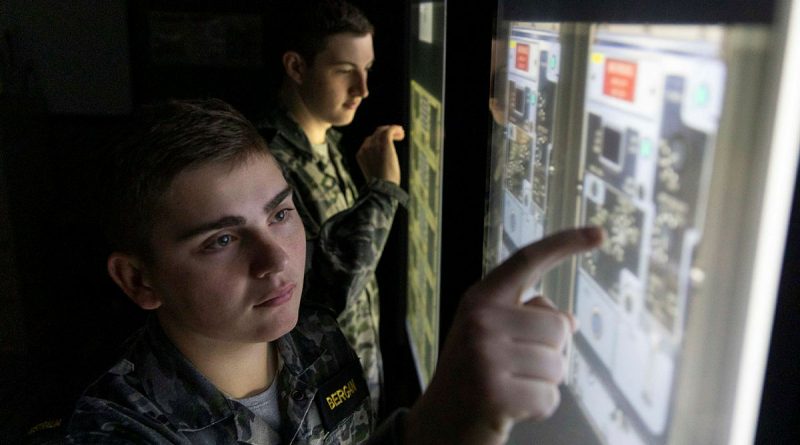 Information systems specialist Seaman Kyle Bergan, left, and communications specialist Seaman Alex Meiklejohn conduct a fault-finding exercise in the communication centre simulator. Story by Sub-Lieutenant Cinaed Finall. Photos by Leading Seaman James McDougall.