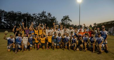 The Royal Australian Corps of Signals and Spartans Rugby Club members and supporters gather in celebration of breaking the Guinness World Record for the longest marathon playing touch/mini/tag rugby game. Story by Captain Evita Ryan. Photo by Warrant Officer Class 2 Kim Allen.