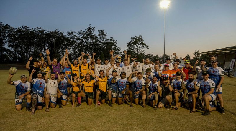 The Royal Australian Corps of Signals and Spartans Rugby Club members and supporters gather in celebration of breaking the Guinness World Record for the longest marathon playing touch/mini/tag rugby game. Story by Captain Evita Ryan. Photo by Warrant Officer Class 2 Kim Allen.