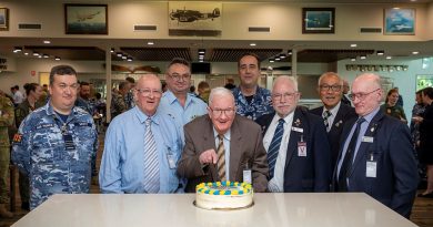 Centenarian and Bomber Command Veteran Angus Hughes cuts his birthday cake with veterans, Group Captain Greg Weller and members of 462 Squadron at RAAF Base Edinburgh. Story by Pilot Officer Shanea Zeegers. by Sergeant David Cotton.