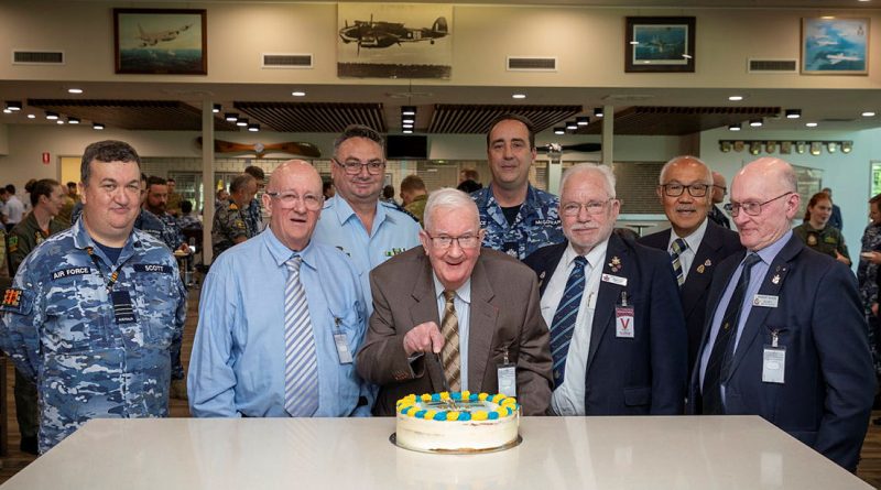 Centenarian and Bomber Command Veteran Angus Hughes cuts his birthday cake with veterans, Group Captain Greg Weller and members of 462 Squadron at RAAF Base Edinburgh. Story by Pilot Officer Shanea Zeegers. by Sergeant David Cotton.