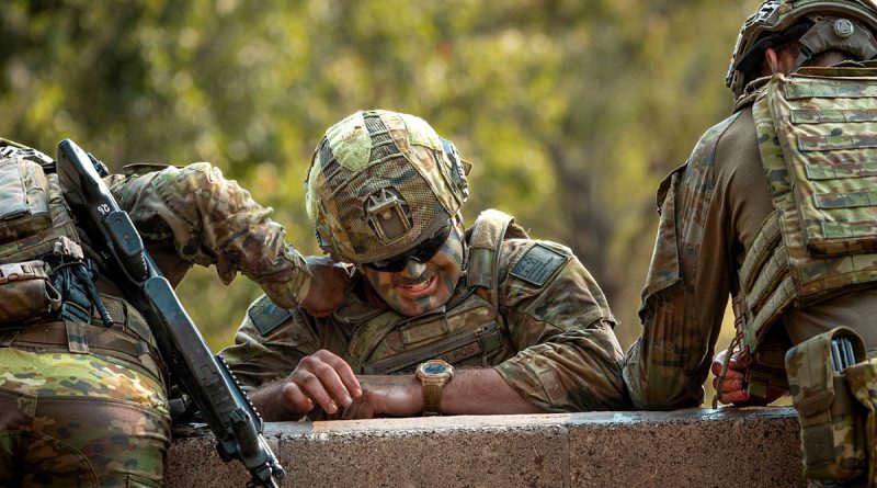 Australian Army troopers from the 2nd/14th Light Horse Regiment (Queensland Mounted Infantry) help a mate over a 10-foot wall, during the 7th Brigade Military Skills Competition at Gallipoli Barracks, Brisbane. Story by Captain Cody Tsaousis. Photo by Corporal Nicole Dorrett.