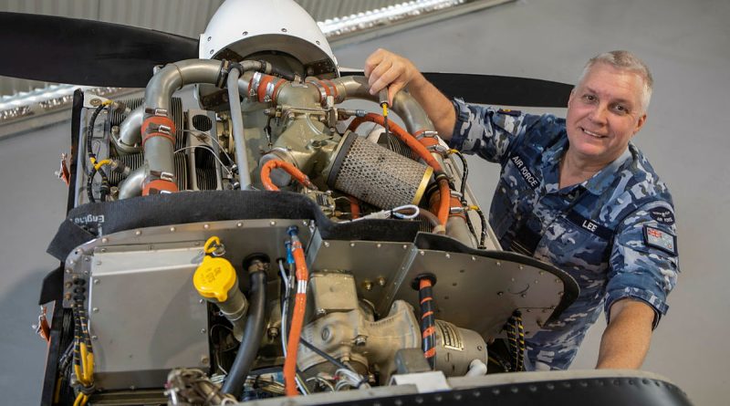 Squadron Leader Mark Lees works on a CT4A as the 100 Squadron senior engineering officer at RAAF Base Point Cook in 2022. Story by Leading Aircraftwoman Casey-Lee Rebellato. Photo by David Jones.