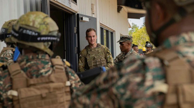 Soldiers from the 5th Battalion, the Royal Australian Regiment, and the Timor Leste Defence Force listen to a safety brief ahead of conducting an urban operations scenario at the indoor training facility at Robertson Barracks, NT. Story by Captain Annie Richardson. Photo by Sub-Lieutenant Chloe Reay.