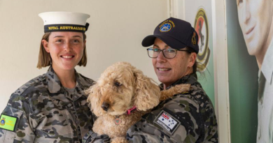 Recruit Cassandra Kelly, left, and Recruit School Petty Officer Deborah Barthelson with her dog, Molly Grace, at HMAS Cerberus Recruit School, Melbourne. Story by Lieutenant Jessica Craig. Photo by Able Seaman Jasmine Moody.