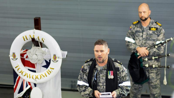 Navy Chaplain Bradley Galvin addresses HMAS Toowoomba ship’s company as they commemorate Remembrance Day in the East China Sea during a regional presence deployment. Story by Lieutenant Commander Kieran Davis. Photo by Leading Seaman Ernesto Sanchez.