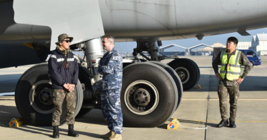 Leading Aircraftman Zachary Delaney (second from left), a RAAF linguist speaks to a Republic of Korea Air Force member on the flightline at Gimhae Air Base, in South Korea. Story by Flight Lieutenant Steffi Blavius.