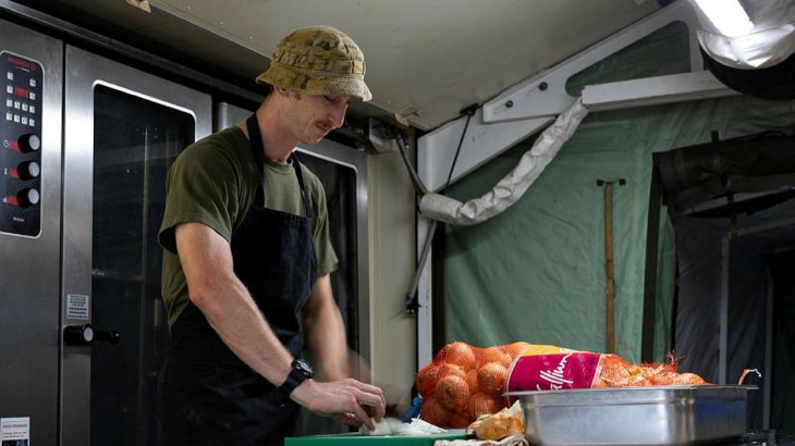 Australian Army cook Private Aaron Blair prepares food for deployed personnel at the Camp Clark deployable kitchen at the 2023 Pacific Games in Honiara, Solomon Islands. Story by Major Roger Brennan. Photo by Leading Seaman Jarrod Mulvihill.