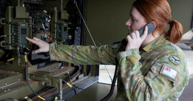 Air battle manager Flying Officer Kim Petterson performs start-up checks on a G-Wagon Command Post Module being trialled under Project Bandicoot. Story by Corporal Veronica O'Hara. Photo by Sergeant Pete Gammie.