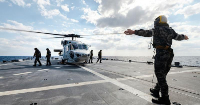 Leading Seaman Ruben Villis marshals personnel from JS Sazanami’s embarked Super Auk helicopter as it prepares to take-off from HMAS Brisbane during a cross-deck in the Philippine Sea as part of Exercise Nichi Gou Trident. Story by Lieutenant Max Logan. Photo by Leading Seaman Daniel Goodman.