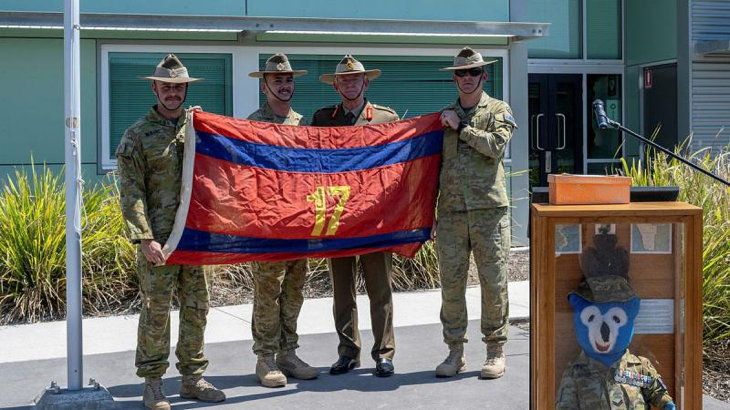 From left, Officer Commanding 17th Construction Squadron Major Lincoln Barbare, flag orderly Sapper Jack Miles, Major General Stephen Day and Squadron Sergeant Major 17th Construction Squadron Warrant Officer Class Two Taj Whelan with the returned flag at RAAF Base Amberley, Queensland. Story by Captain Evita Ryan. Photo by Warrant Officer Class Two Kim Allen.