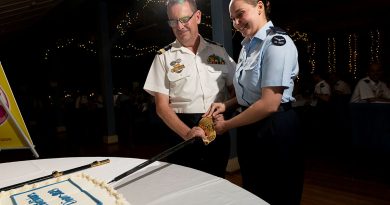 Commander Air Mobility Group Air Commodore Bradley Clarke and Aircraftwoman Jorja Winterford cut the cake during the annual Air Mobility Group Pathfinder Awards Dinner at RAAF Base Richmond. Story by Tastri Murdoch. Photos by Leading Aircraftman Chris Tsakisiris.