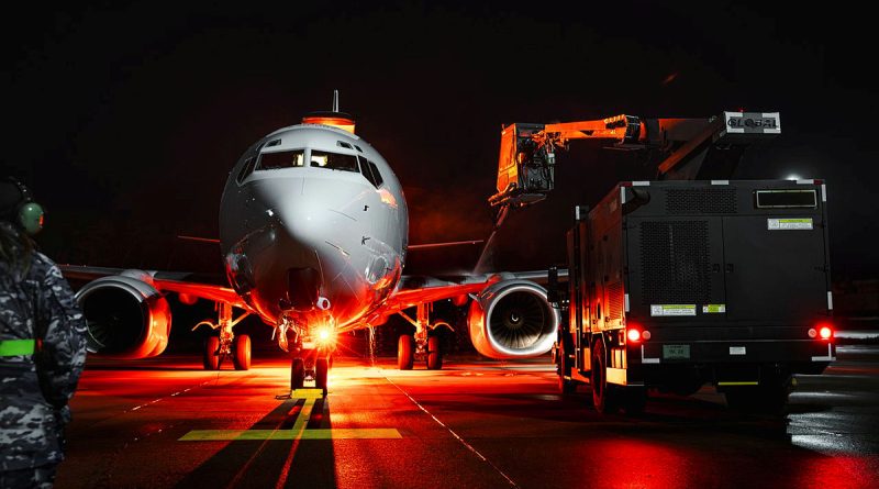 Personnel from 2 Squadron operate an aircraft de-icing machine to remove ice and snow from an E-7A Wedgetail during Operation Kudu in Germany. Story by Major Carrie Robards. Photos by Leading Aircraftman Adam Abela.