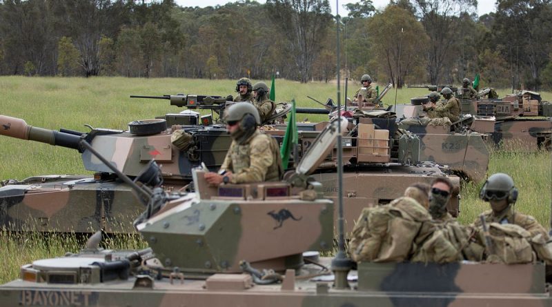 Australian Army soldiers prepare for a combat team quick attack with M1A1 Abrams and M113AS4 armoured personnel carriers during Exercise Iron Warrior 23 at Puckapunyal. Story and photos by Corporal Michael Rogers.