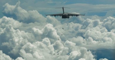 Members of the Australian Army's 2nd Commando Regiment conduct a free-fall parachute jump from a RAAF C-17A Globemaster III to commemorate the 80th anniversary of the Nadzab Landings in September 1943. Story by Flying Officer Aarron Dann. Photo by Senior Airman Mackenzie Cooper.