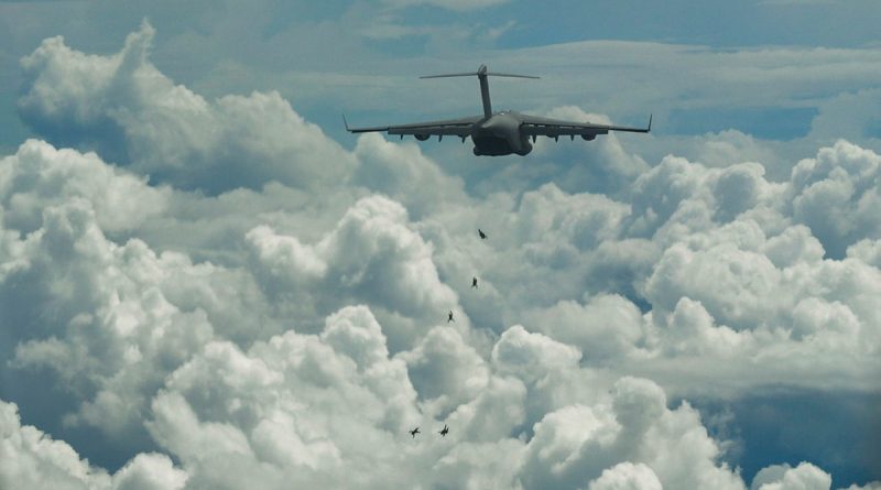 Members of the Australian Army's 2nd Commando Regiment conduct a free-fall parachute jump from a RAAF C-17A Globemaster III to commemorate the 80th anniversary of the Nadzab Landings in September 1943. Story by Flying Officer Aarron Dann. Photo by Senior Airman Mackenzie Cooper.