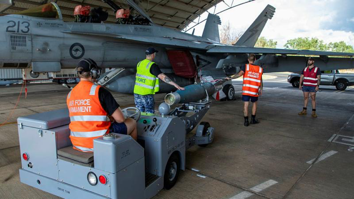Armament technicians from 1 Squadron load a GBU-16 on to an F/A-18F Super Hornet at RAAF Base Tindal during Exercise Crimson Dawn 23-2. Story by Pilot Officer Shanea Zeegers. Photo by Sergeant David Gibbs.