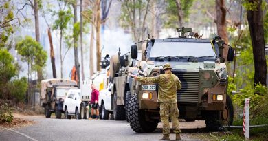 Australian Army soldiers and high -clearance vehicles from 11th Brigade assist in the cleanup at Coomera, following recent violent storms. Photographer unknown.