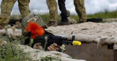 An Armed Forces of Ukraine recruit scans for enemy during trench defence training, as part of Operation Kudu in the United Kingdom. Photo by Leading Aircraftwoman Emma Schwenke.
