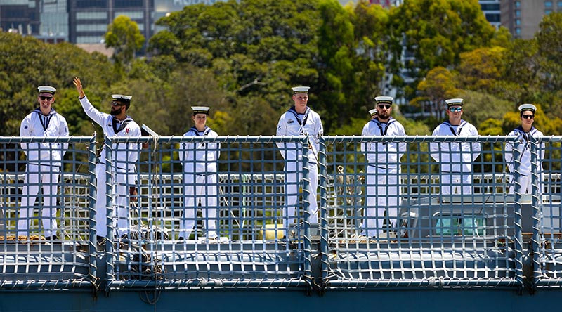 Crew members on HMAS Warramunga wave goodbye to loved ones as they depart Fleet Base East, Sydney, to conduct an Indo-Pacific Presence Deployment. Photo by Able Seaman Zac Dingle.