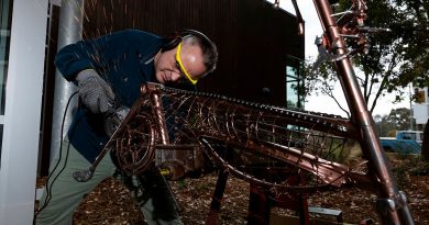 Lieutenant Commander Will Singer works on his repurposed bicycle sculpture as part of the ADF ARRTS program at the University of Canberra's Inspire Centre. Story by Flight Lieutenant Thomas McCoy. Photos by Leading Aircraftwoman Emma Schwenke.