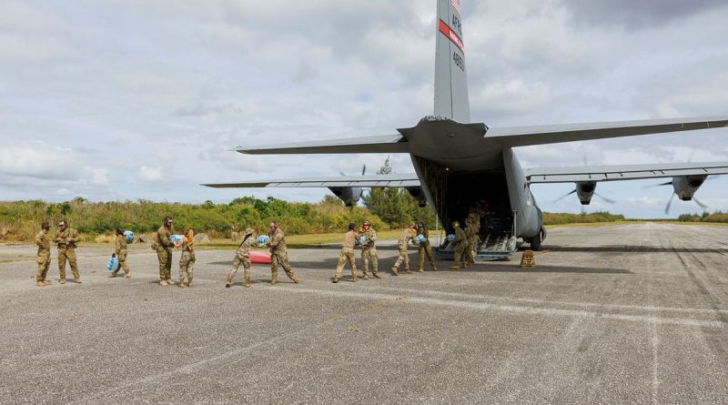 RAAF and US Air Force (USAF) personnel unload cargo from a USAF C-130J aircraft at Tinian North airfield during Exercise Cope North. Story by Flight Lieutenant Claire Campbell. Photos by Leading Aircraftman Kurt Lewis.