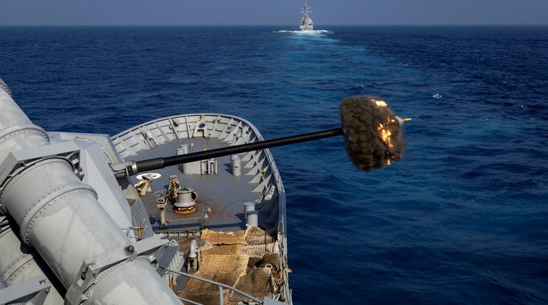 HMAS Warramunga fires its 5-inch naval gun during a joint live-firing with USS Halsey while at sea on regional presence deployment. Story by Lieutenant Commander Andrew Herring. Photos by Petty Officer Leo Baumgartner.