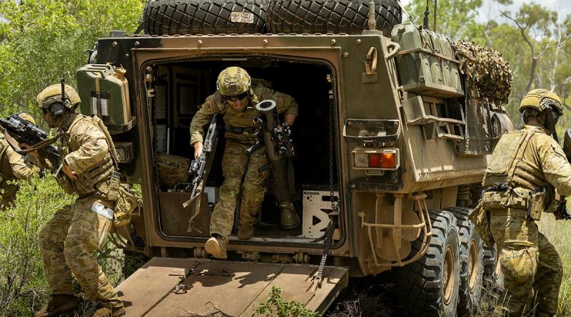 Trooper Lachlan Hinspeter, of 2nd Cavalry Regiment, dismounts from an Australian light armoured vehicle at Townsville Field Training Area, Queensland. Story and photo by Captain Brittany Evans.