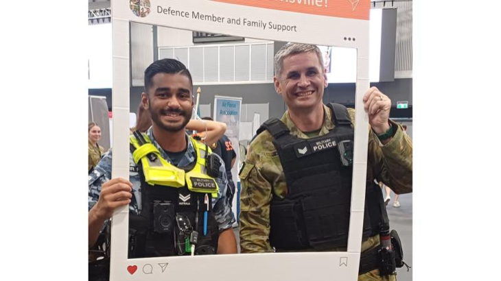 Defence members hold a 'Hello from Townsville' frame up at the 2024 welcome event in Townsville, Queensland. Story by Chelsey Ballard. Photos by Rachel Baker.