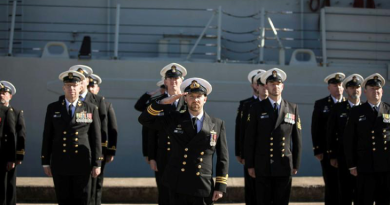 Lieutenant Commander Nicholas Graney salutes during the national anthem as part of HMAS Newcastle’s decommissioning ceremony at Fleet Base East, Sydney, in 2019. Story by Olivia Ransome Gilding. Photo by Able Seaman Jarrod Mulvihill.